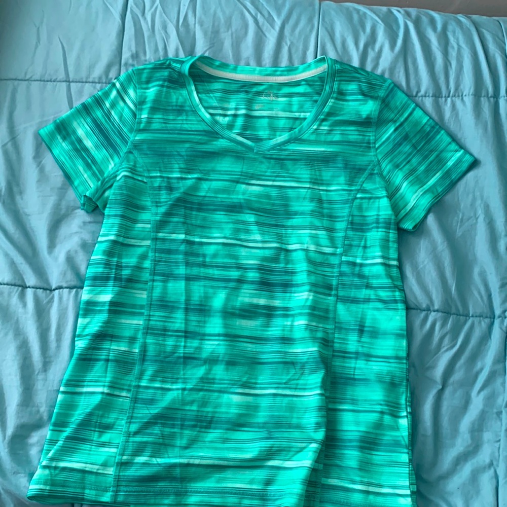 Athletic style shirt sleeve top. Quick dry material.